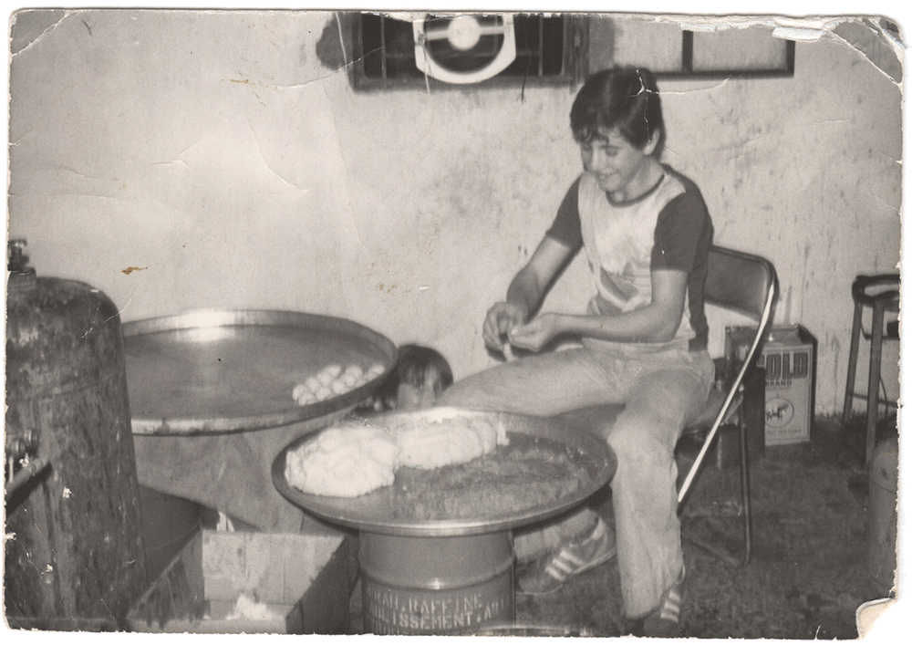 The Lebon Sweets Story - Black and White photo of boy working with dough